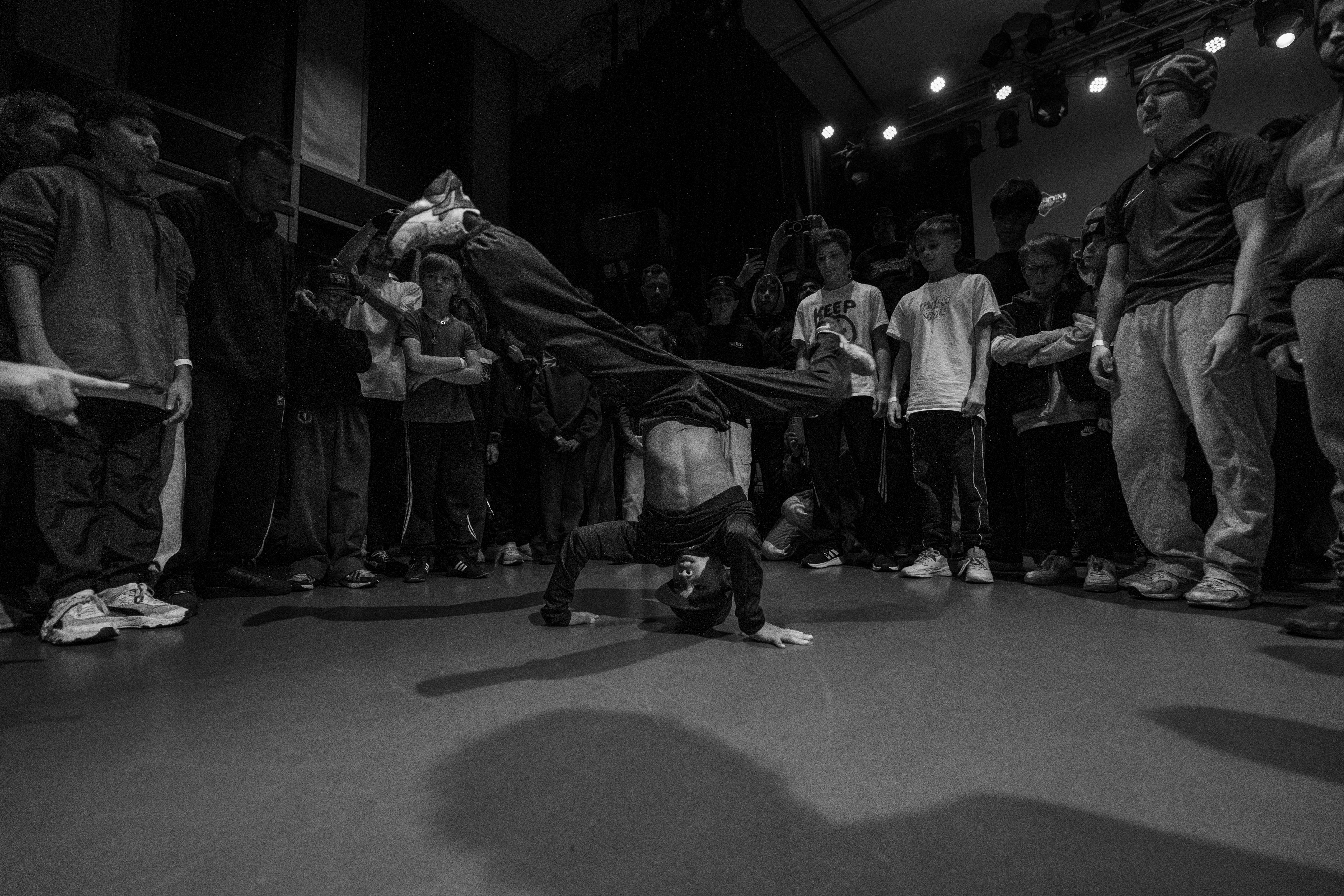 Young B-Boy Spinning on Head in the Cyphers